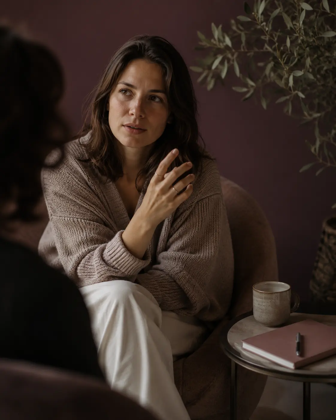 Person sitting in a cozy chair, deep in thought